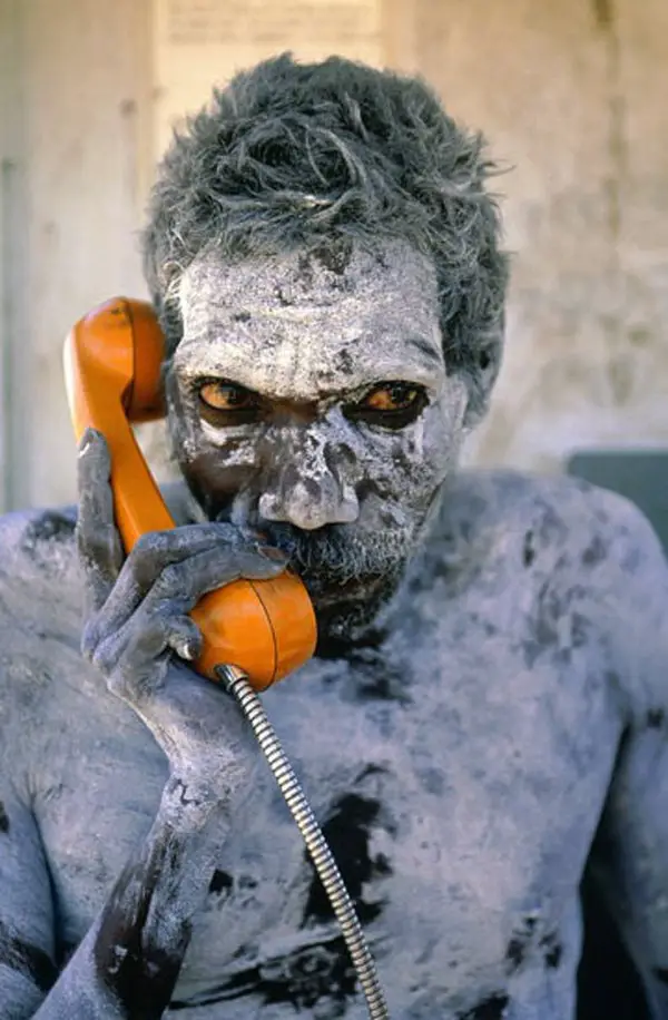 Aboriginal man using newly installed phone for the first time, circa 1980